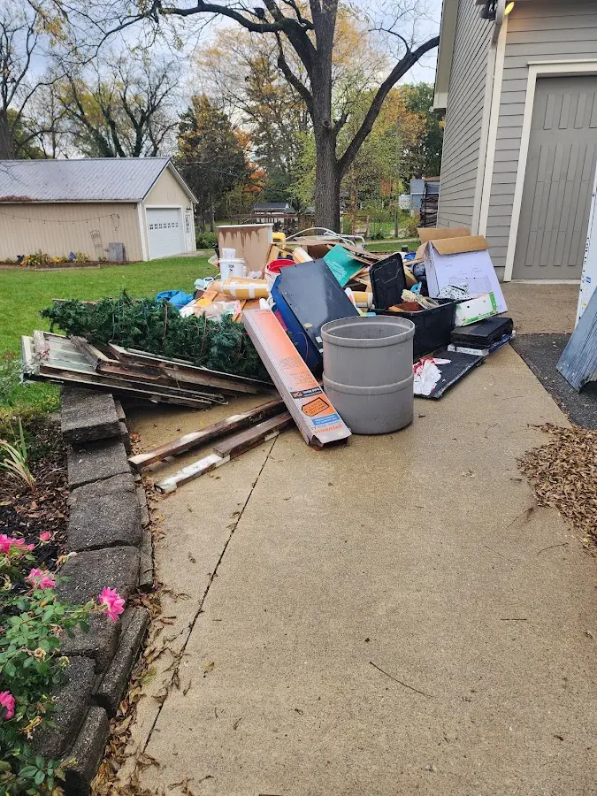 Dumpster being loaded with debris for Estate Cleanout Dumpster Rental in Nyssa